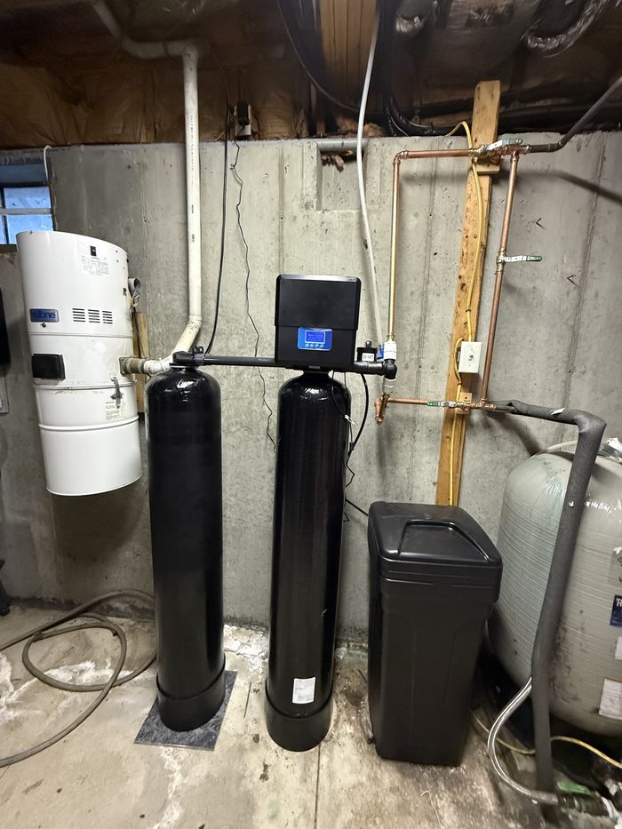 Dual-tank water treatment system installed by Horizon Water Co in a Rhode Island basement